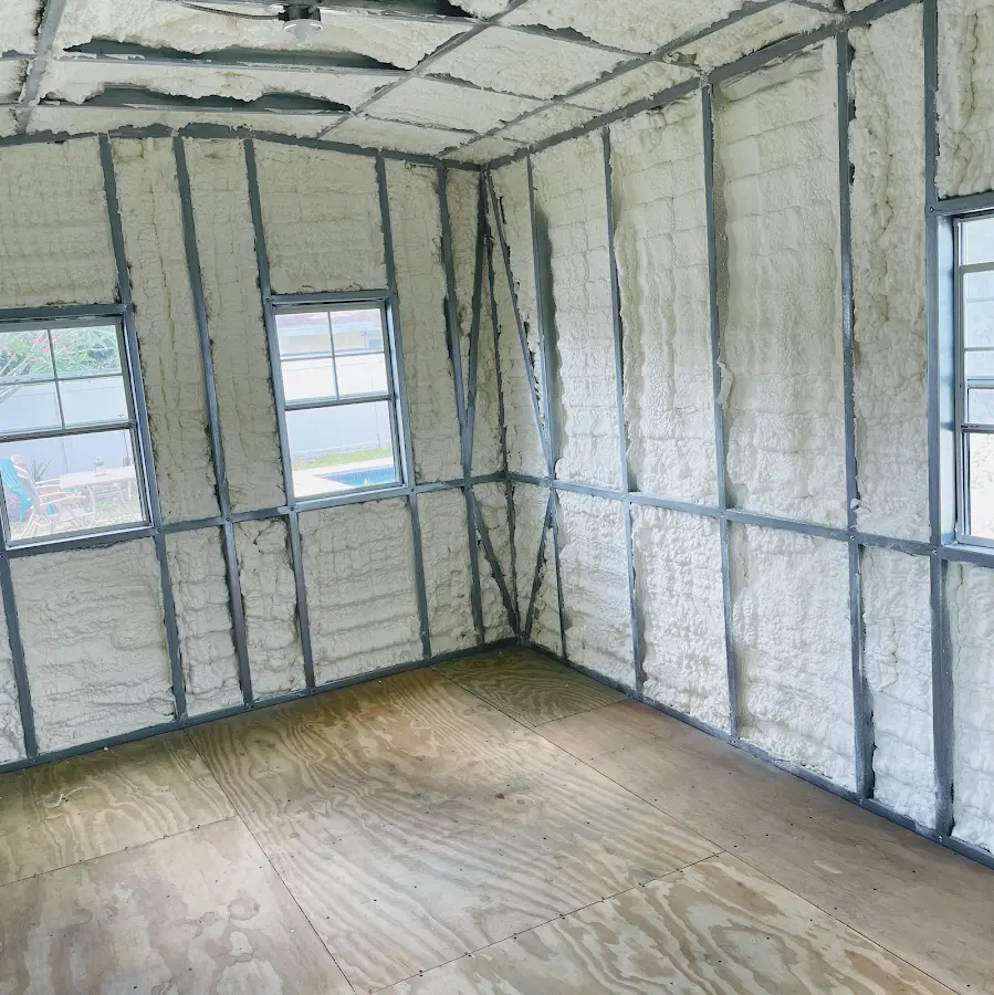 Closed-cell spray foam insulation applied to wall cavities in a residential project in Pierre